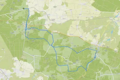 Mapa z zaznaczoną trasą rowerową wokół Olsztyna, prowadzącą przez lasy i wsie.